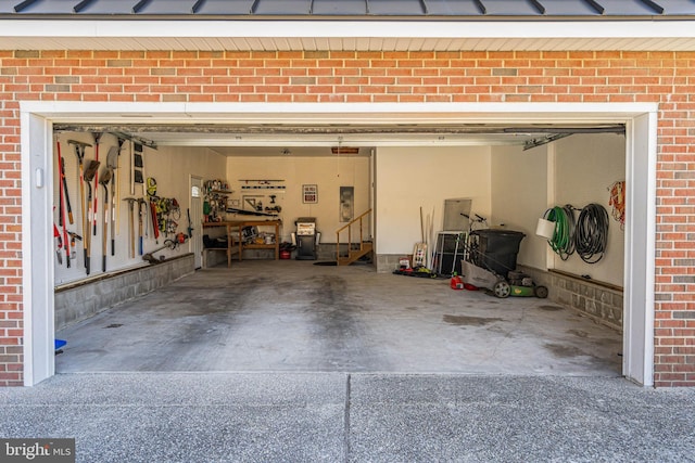 garage featuring concrete driveway