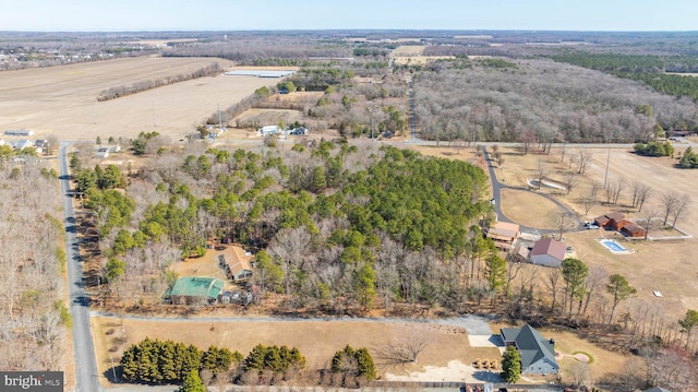 birds eye view of property with a rural view