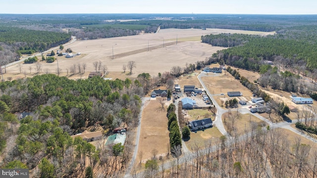 aerial view with a rural view and a wooded view