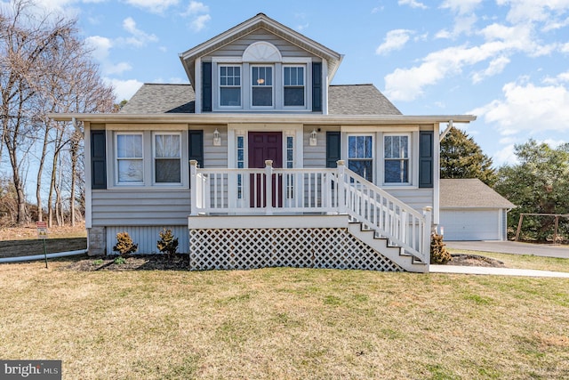 bungalow-style house with a front yard, a porch, a shingled roof, an outdoor structure, and a garage