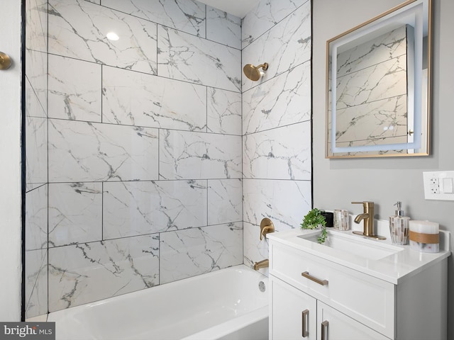 bathroom with vanity and bathing tub / shower combination