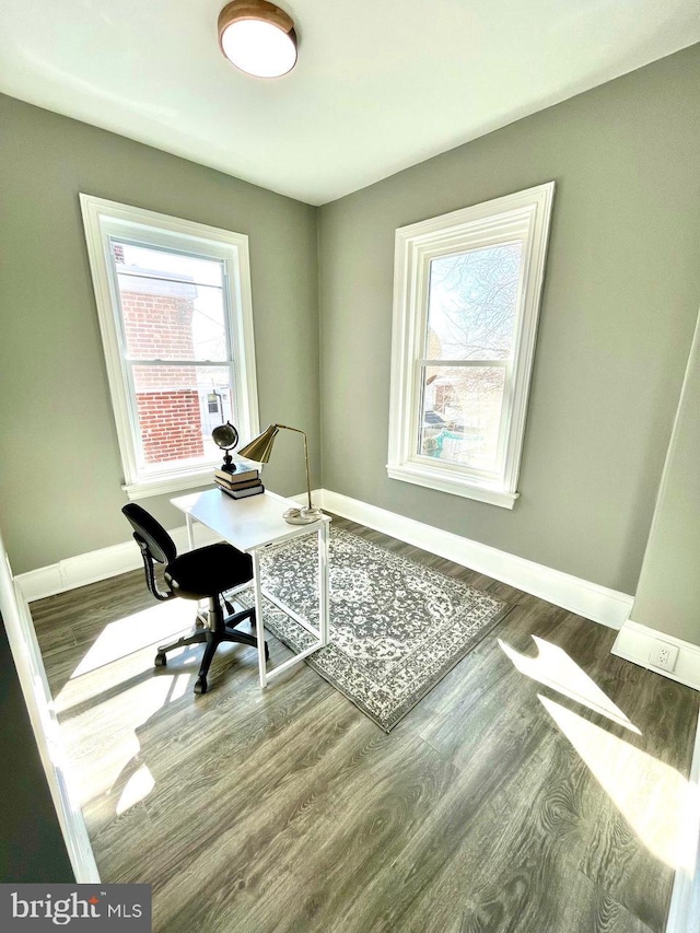 office featuring baseboards and wood finished floors