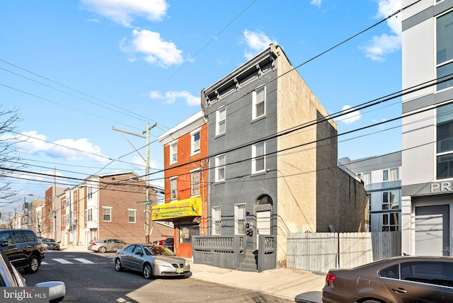 view of property with fence