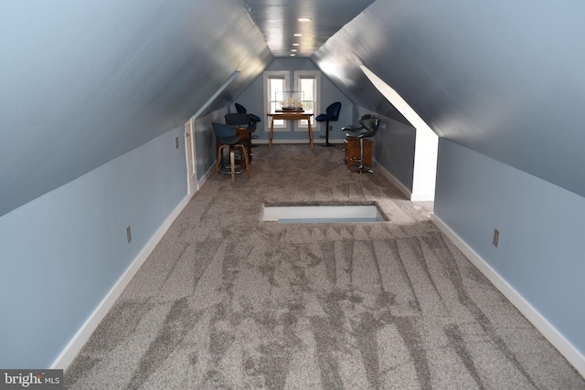 bonus room featuring baseboards, carpet, and vaulted ceiling