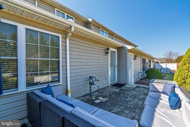 view of patio / terrace featuring fence and an outdoor hangout area