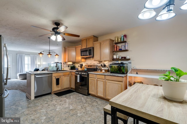 kitchen with backsplash, light brown cabinetry, a peninsula, stainless steel appliances, and a sink