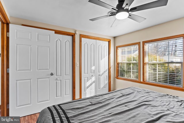 bedroom featuring two closets and a ceiling fan