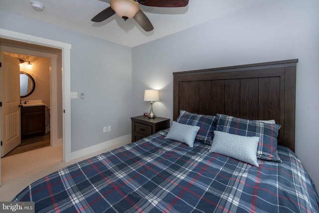 carpeted bedroom featuring a ceiling fan and baseboards