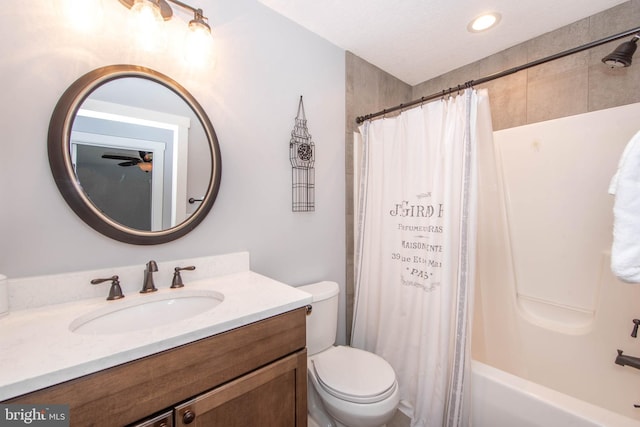 bathroom with vanity, toilet, and shower / tub combo with curtain