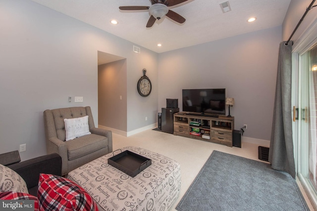 carpeted living room with a ceiling fan, recessed lighting, baseboards, and visible vents