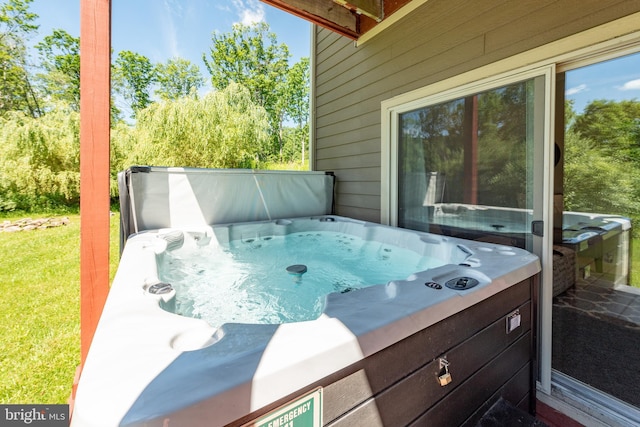 exterior space featuring a hot tub