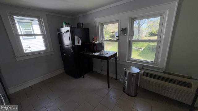 28 Harding Ave, Pennsville, NJ 08070 - kitchen featuring black microwave, fridge, a wealth of natural light, and baseboards