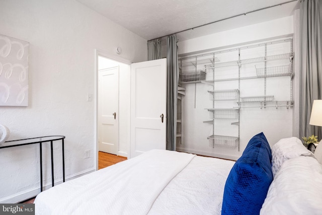 bedroom featuring wood finished floors