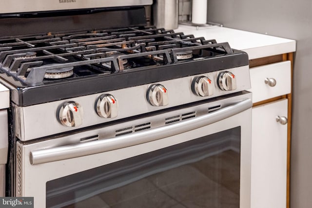 interior details featuring stainless steel range with gas stovetop