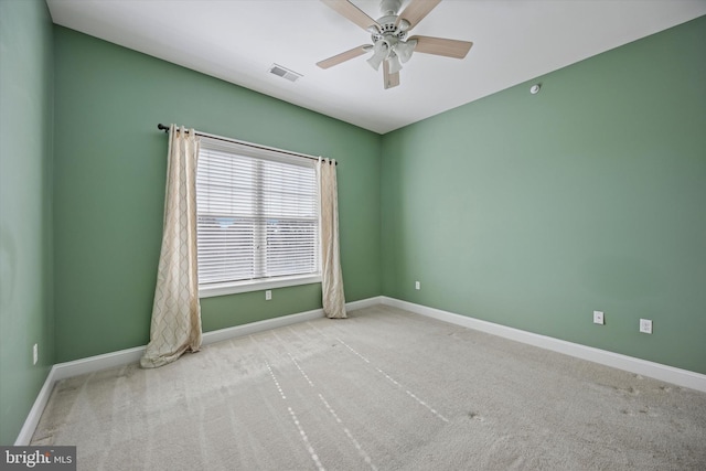 unfurnished room featuring visible vents, baseboards, a ceiling fan, and carpet flooring