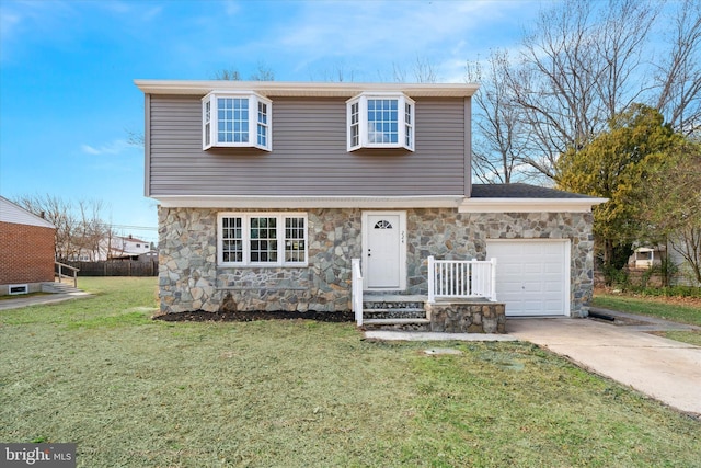 colonial inspired home with a garage, stone siding, concrete driveway, and a front lawn