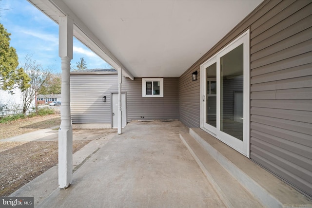 view of patio / terrace with a carport