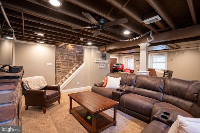 living room with visible vents, light carpet, a ceiling fan, baseboards, and stairs