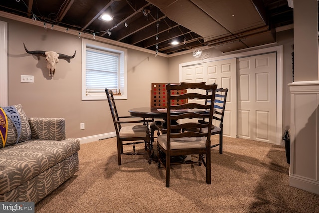 dining area with baseboards and carpet flooring