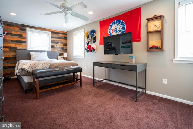 carpeted bedroom with recessed lighting, baseboards, wood walls, and ceiling fan