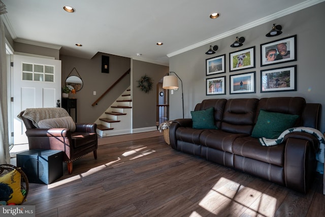 living room with crown molding, stairs, and wood finished floors