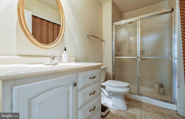 bathroom with a shower stall, vanity, and toilet