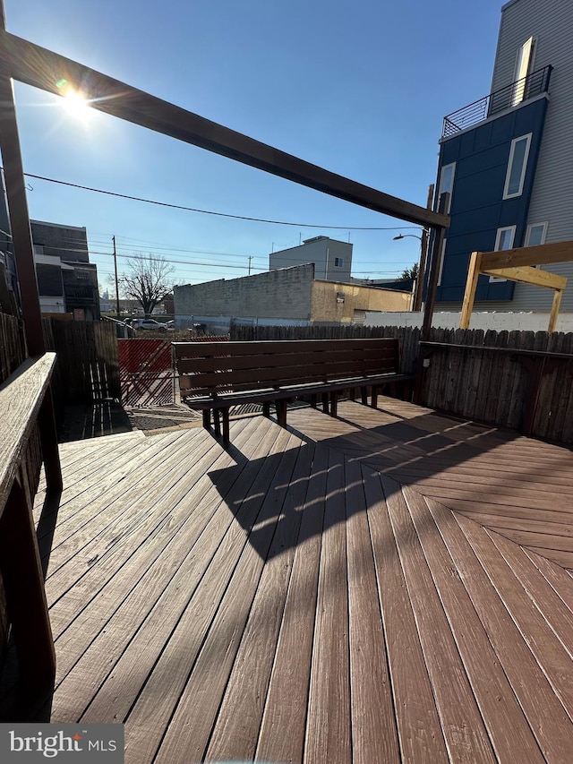 wooden deck featuring fence