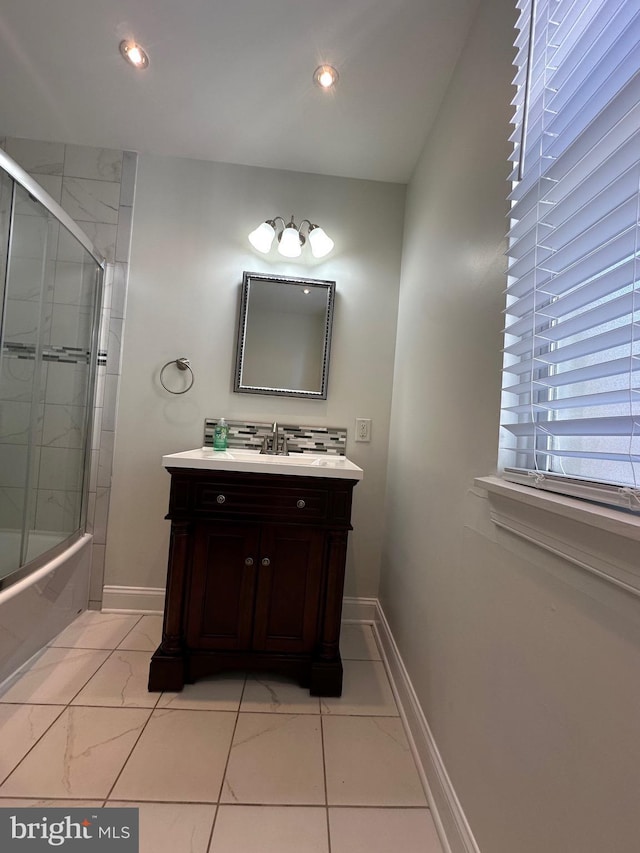 full bathroom featuring recessed lighting, vanity, baseboards, and shower / bath combination with glass door