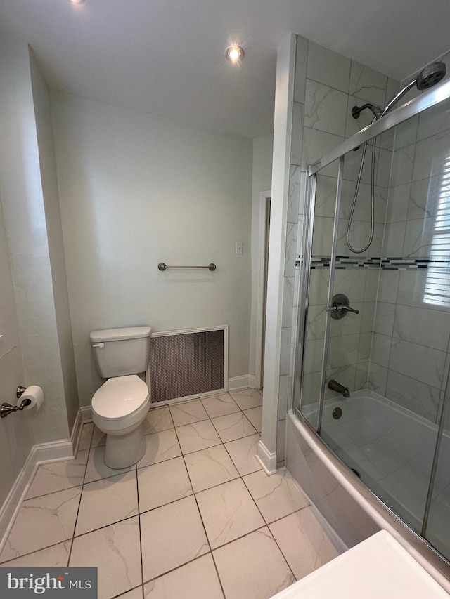 full bathroom with enclosed tub / shower combo, marble finish floor, toilet, and baseboards