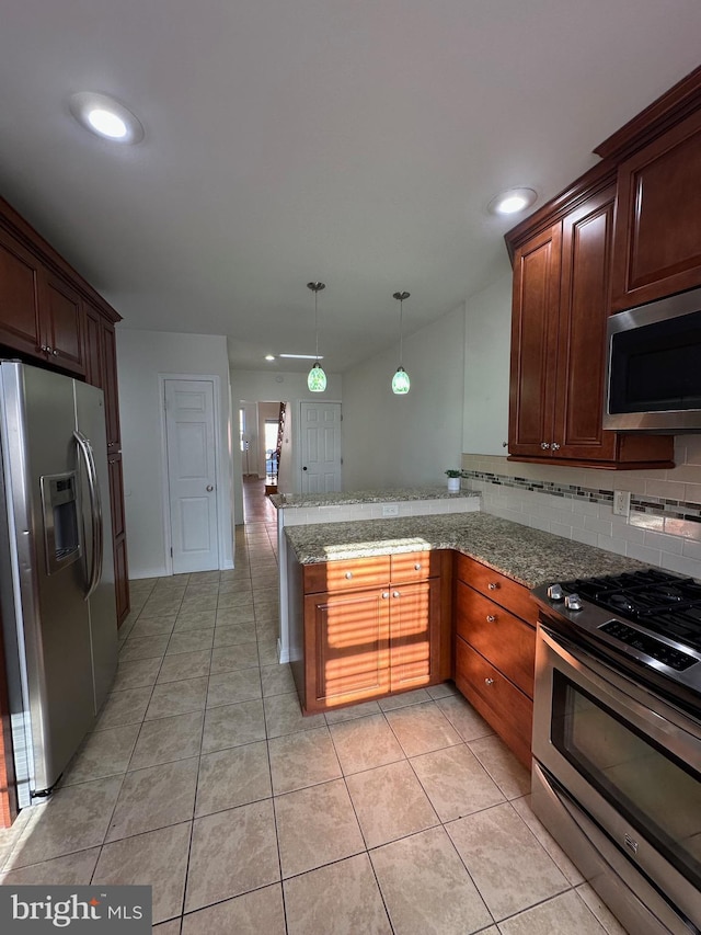 kitchen featuring decorative light fixtures, light tile patterned floors, decorative backsplash, a peninsula, and stainless steel appliances