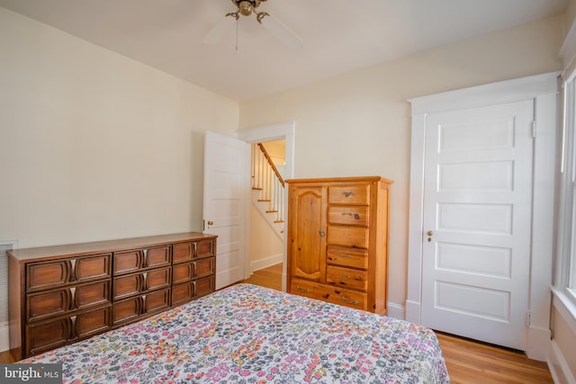 bedroom with ceiling fan and light wood finished floors