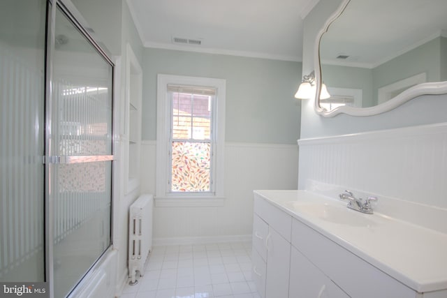 bathroom featuring visible vents, a wainscoted wall, radiator heating unit, tile patterned floors, and vanity