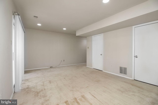 finished basement featuring recessed lighting, visible vents, carpet floors, and baseboards