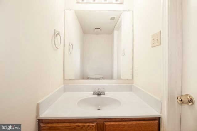 bathroom featuring visible vents and vanity