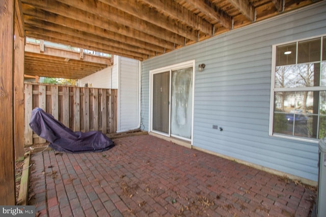 view of patio featuring fence