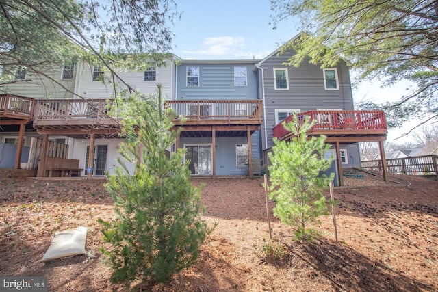 rear view of house featuring a deck