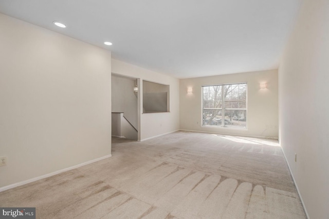 unfurnished room featuring carpet flooring, recessed lighting, and baseboards