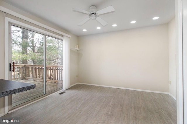 unfurnished room featuring plenty of natural light, baseboards, and visible vents