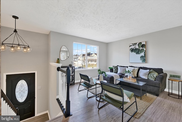 living room featuring wood finished floors and baseboards