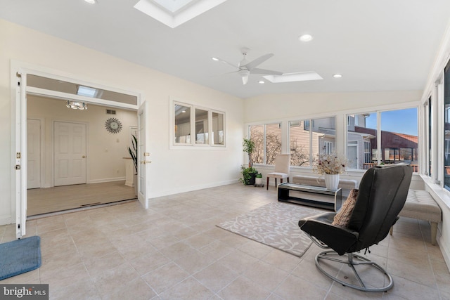 interior space featuring recessed lighting, baseboards, lofted ceiling with skylight, and a ceiling fan