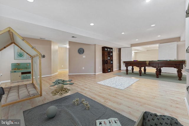 recreation room featuring recessed lighting, baseboards, and wood finished floors