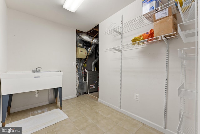 spacious closet with tile patterned flooring and heating unit