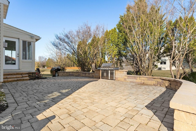 view of patio / terrace featuring grilling area and an outdoor kitchen