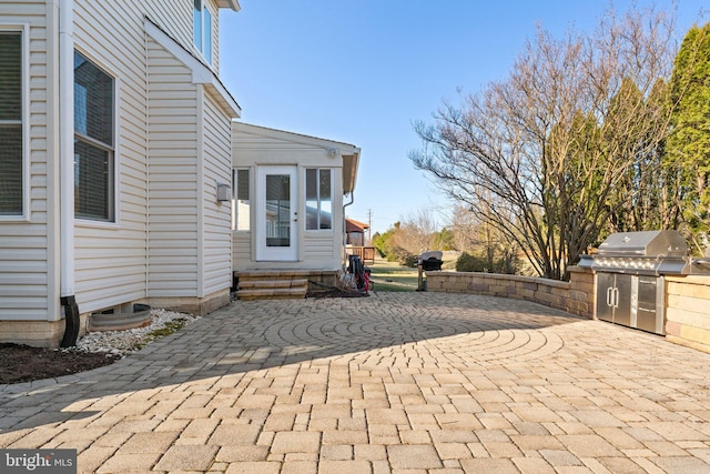 view of patio / terrace featuring exterior kitchen and entry steps