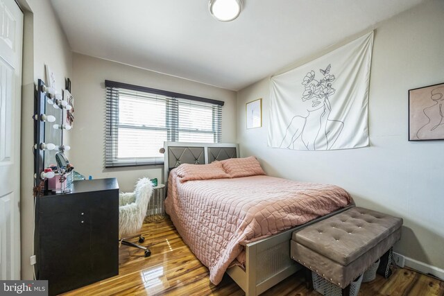 bedroom with wood finished floors