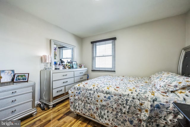 bedroom with wood finished floors