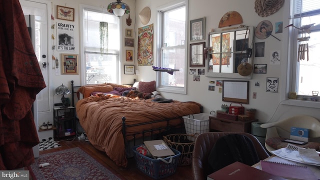 bedroom featuring wood finished floors