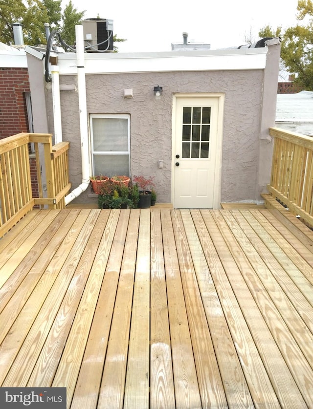 wooden terrace with central AC unit