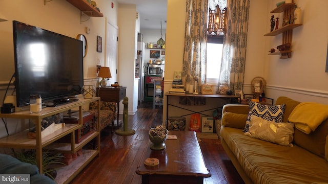 living area with hardwood / wood-style flooring