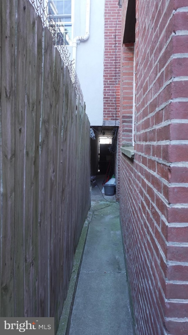 view of property exterior with brick siding